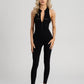 Sleek black Day to Night Jumpsuit with front zipper for adjustable coverage.