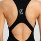 Sleek black Day to Night Jumpsuit with front zipper for adjustable coverage.