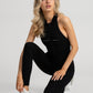 Day to Night Jumpsuit in black with a flattering low-back design for women.